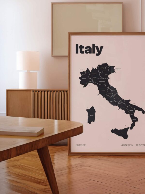 The Custom Country Maps Art Print featuring a black map of Italy, displayed in a wooden frame, with simple text labeling the country, in a stylish interior setting.