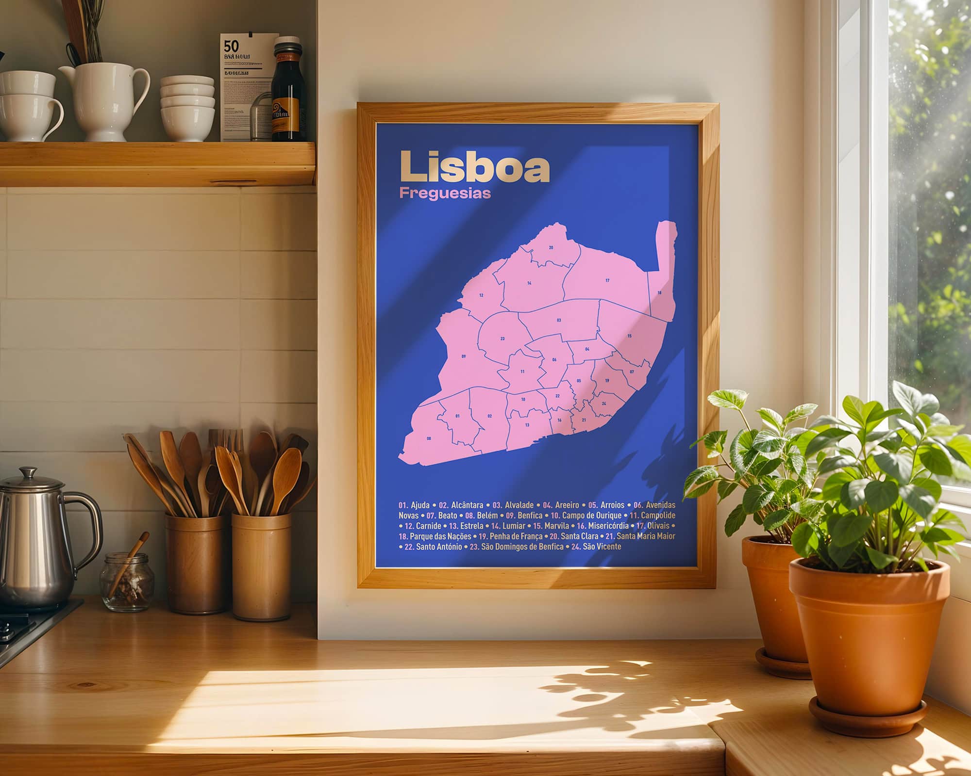 Framed Lisboa map print displayed in modern kitchen with plants and utensils