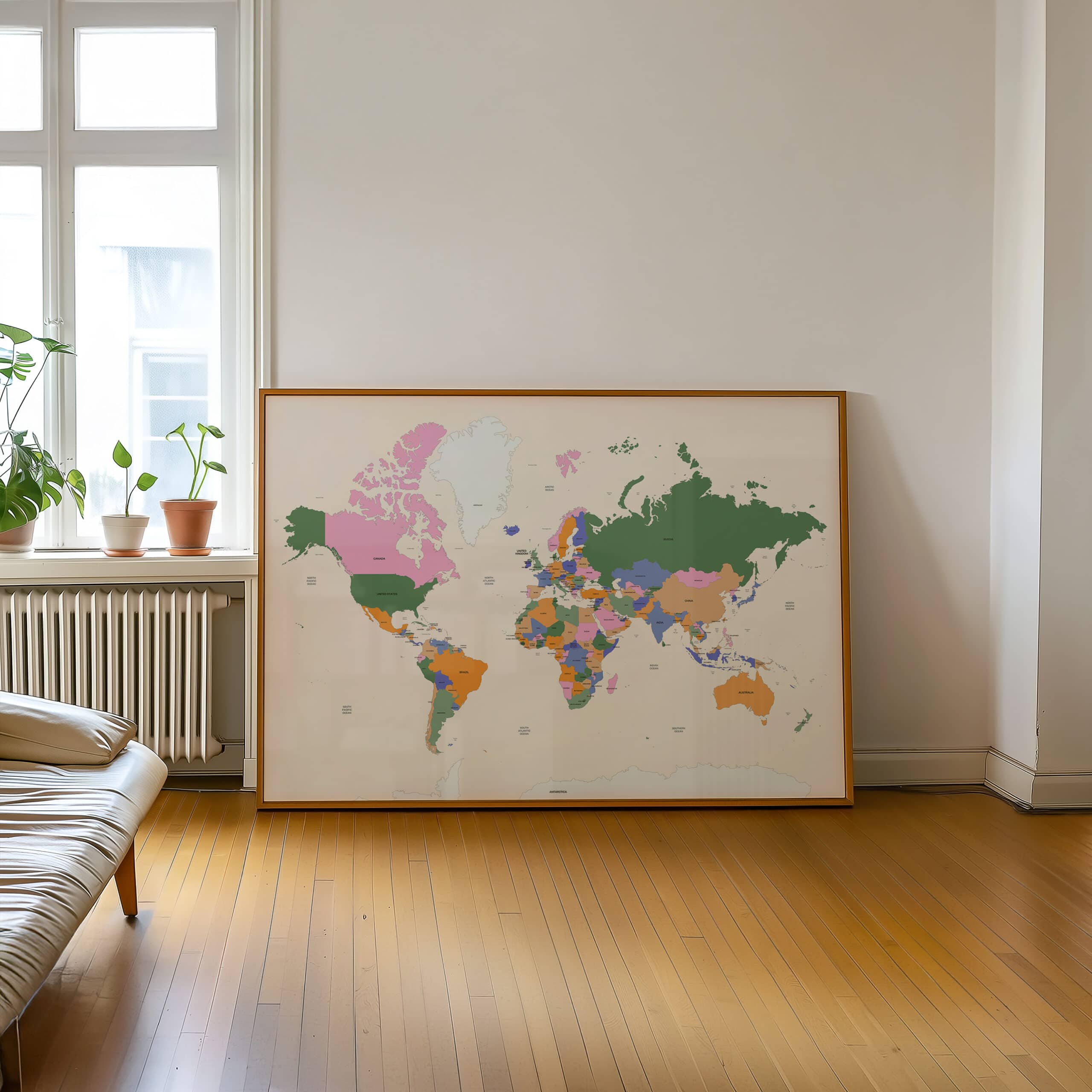 Colorful framed world map leaning against living room wall with plants nearby